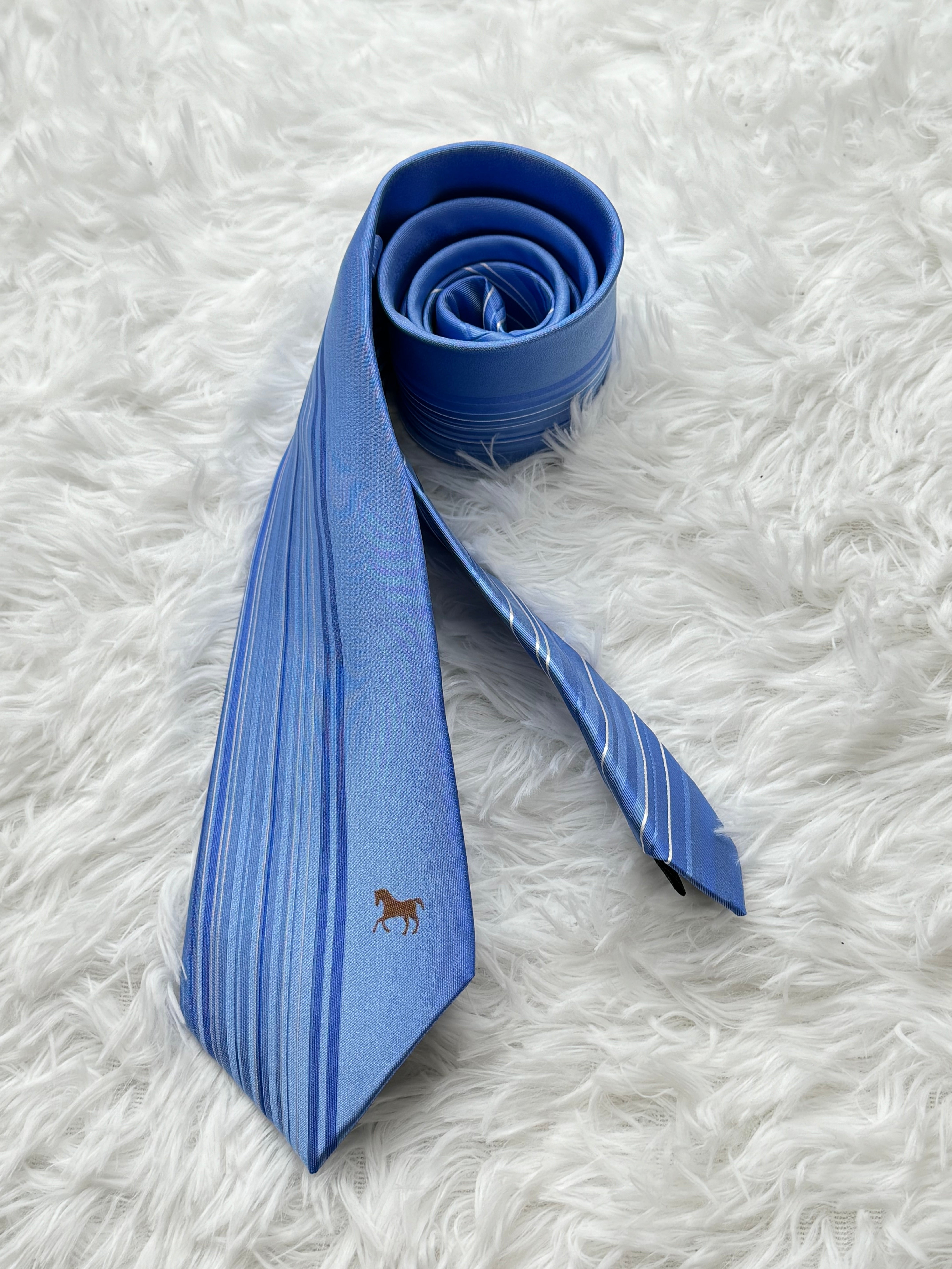 Light blue business tie with beveled edge stripes