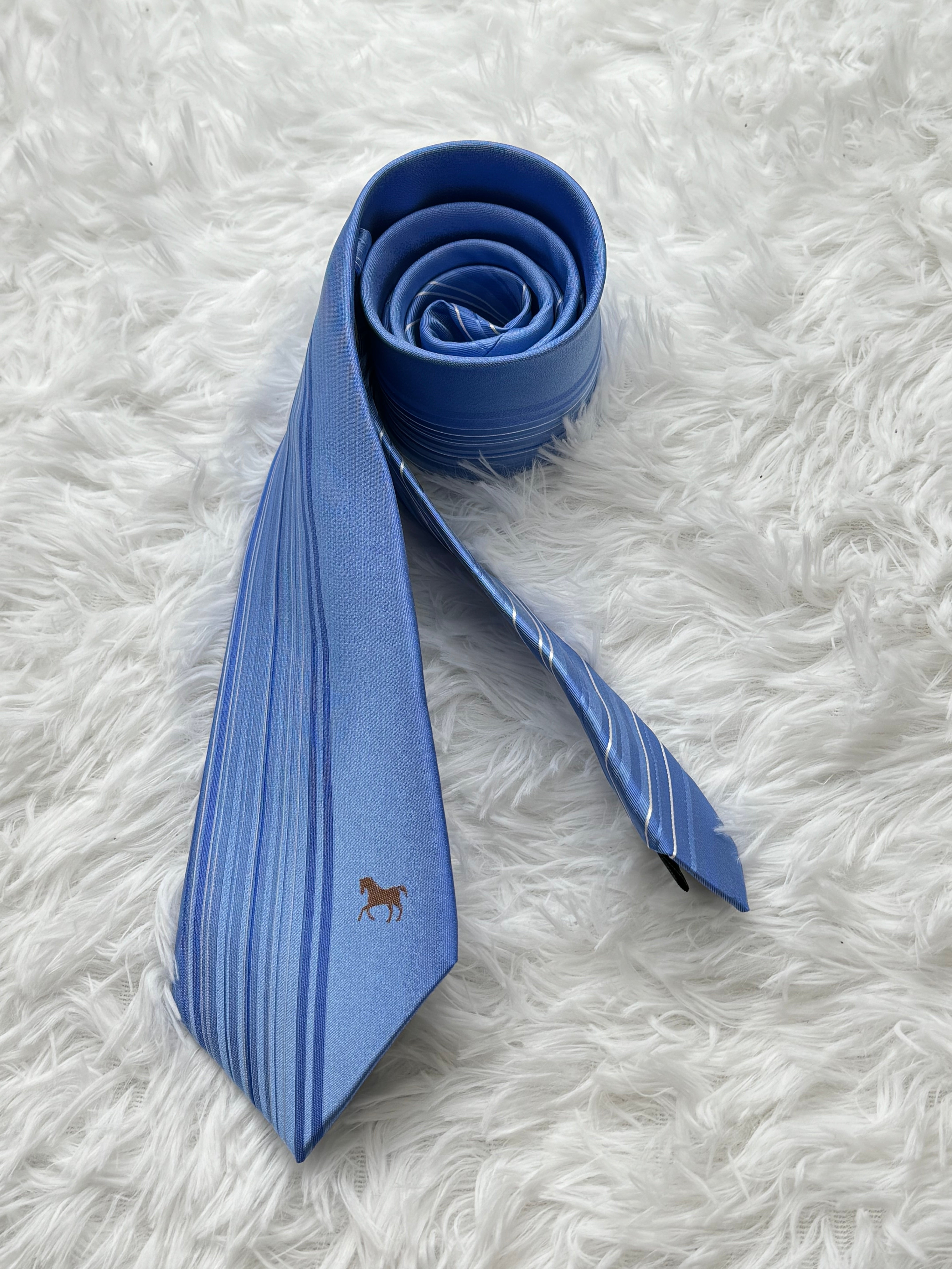Light blue business tie with beveled edge stripes