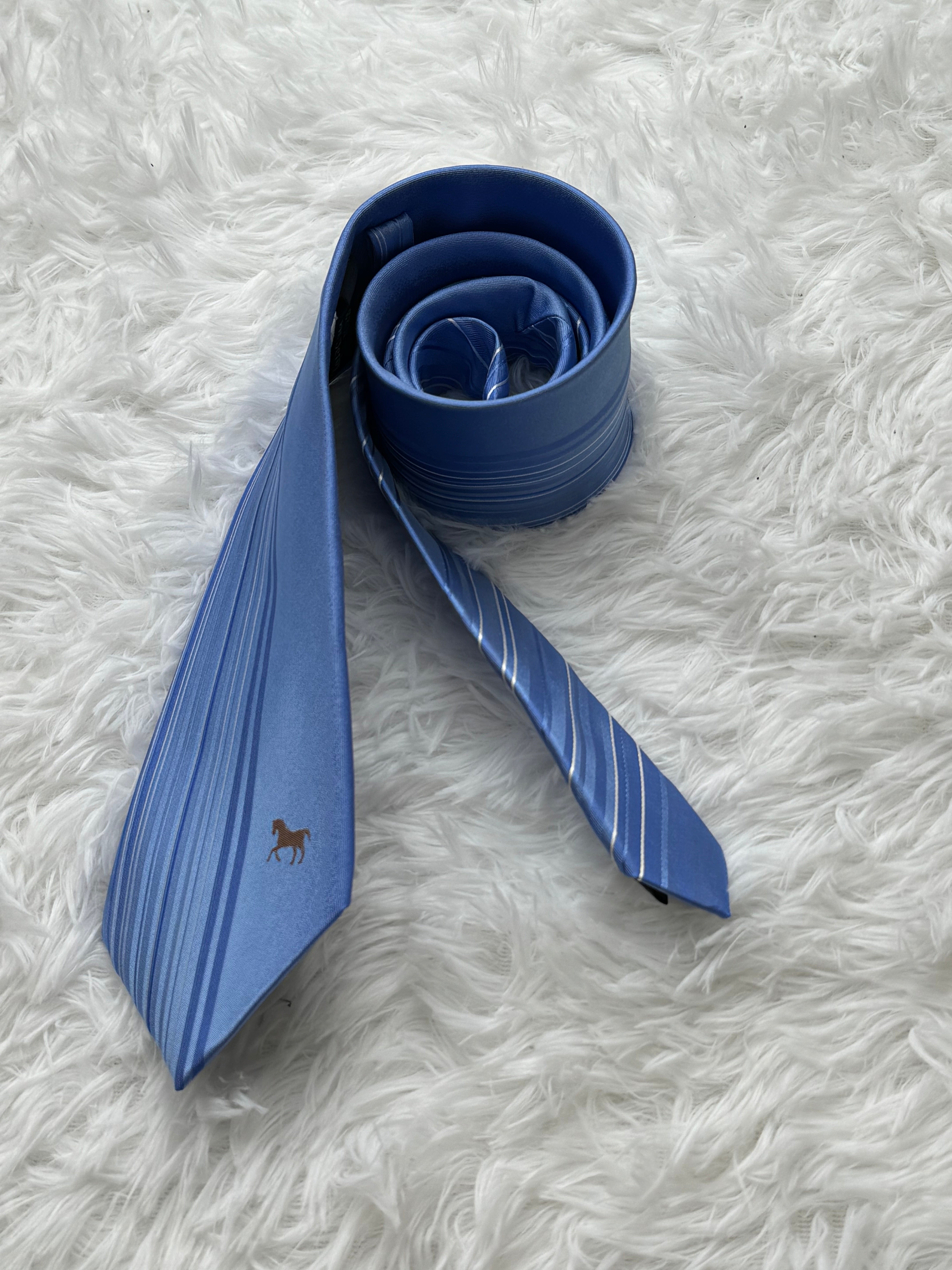 Light blue business tie with beveled edge stripes
