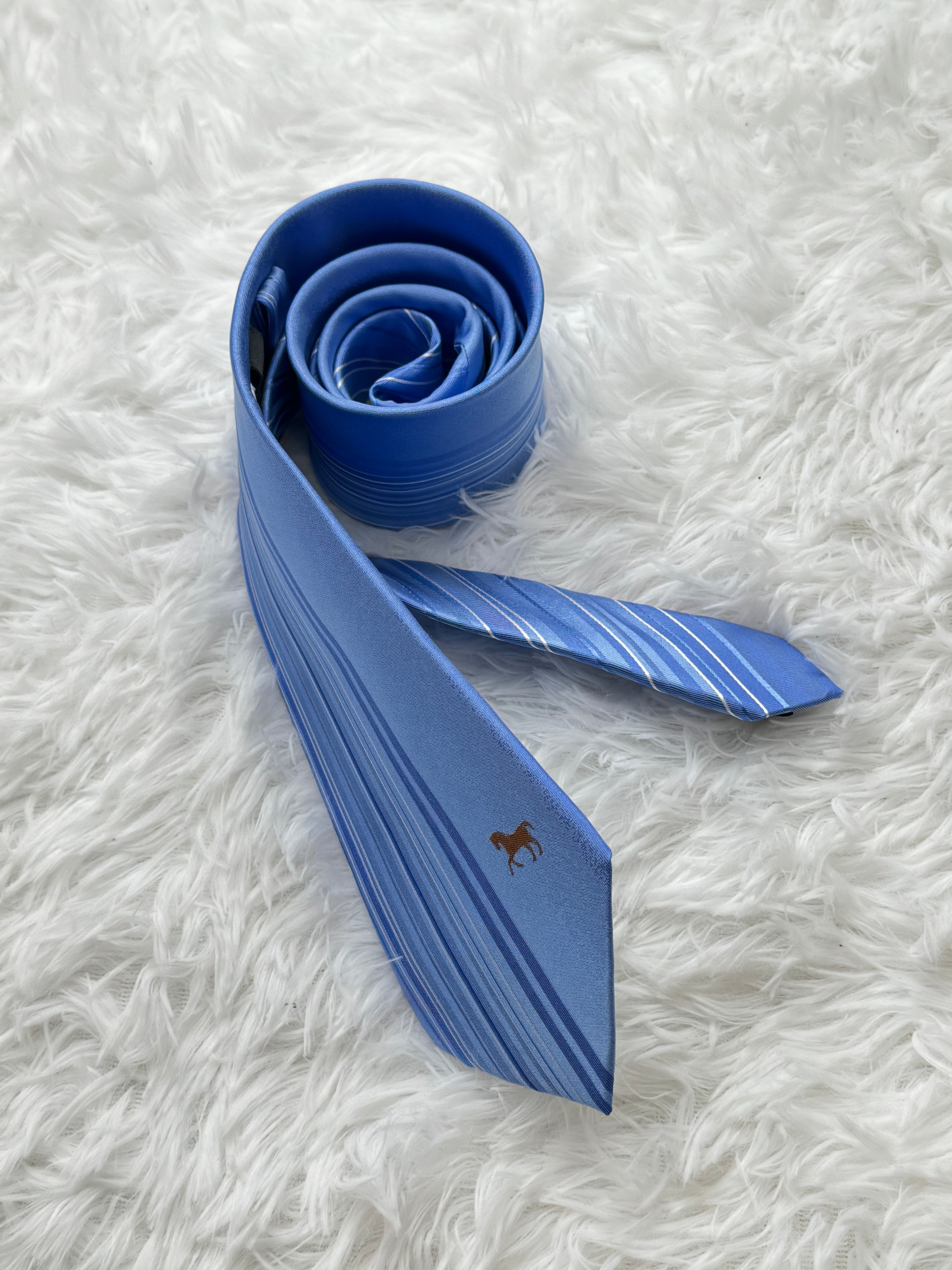 Light blue business tie with beveled edge stripes